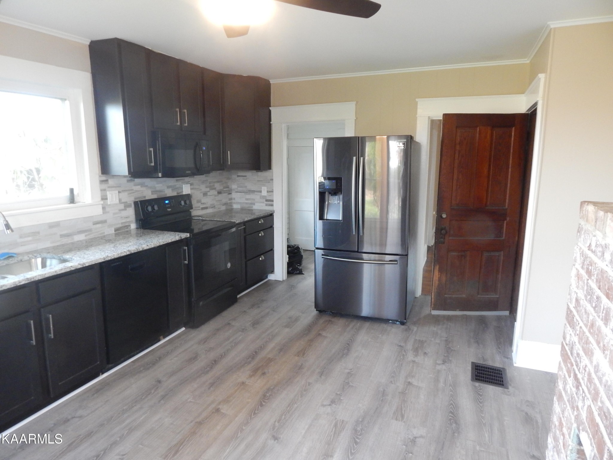 367 Reed Road Greeneville, TN 37745 - Photo 30 of 51 a kitchen with stainless steel appliances granite countertop a refrigerator a sink a stove and oven