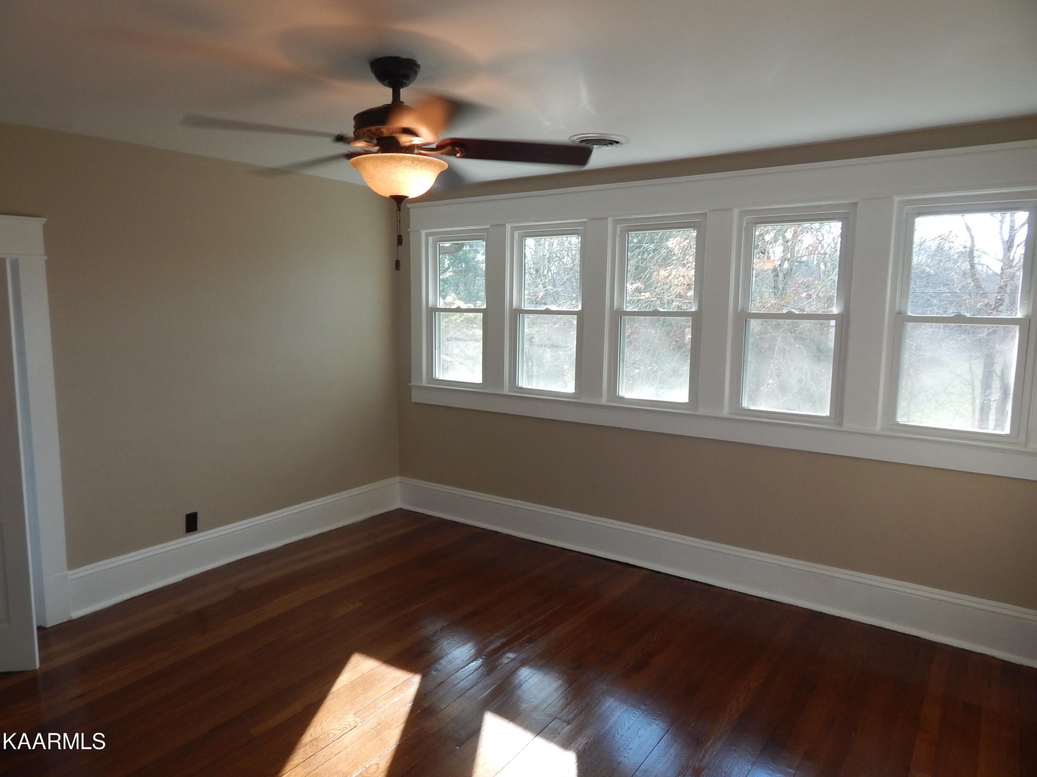 367 Reed Road Greeneville, TN 37745 - Photo 43 of 51 a view of an empty room with wooden floor and a window