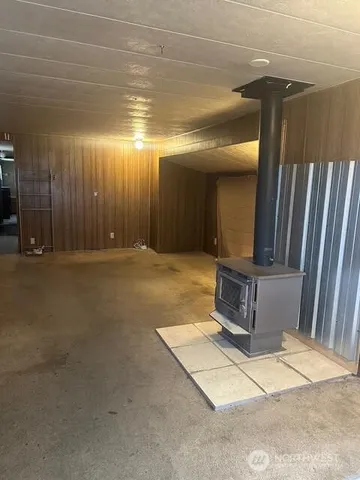a view of a hall with wooden floor