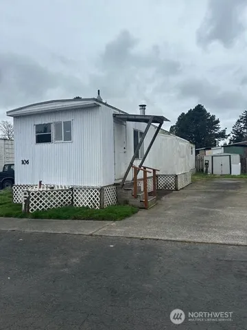 a view of a house with a street