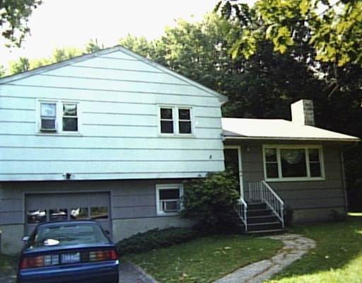 64 Old Ridgebury Road Danbury, CT 06810 - Photo 1 of 1 a front view of a house with garden