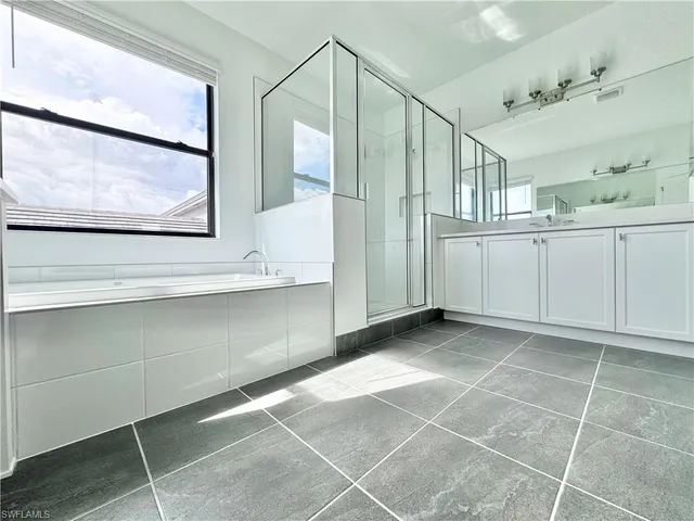 a view of a chairs and table in patio