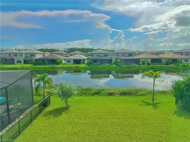 a view of a lake with a yard