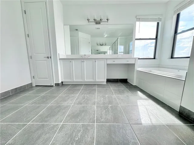 a view of a chairs and table in patio with a yard
