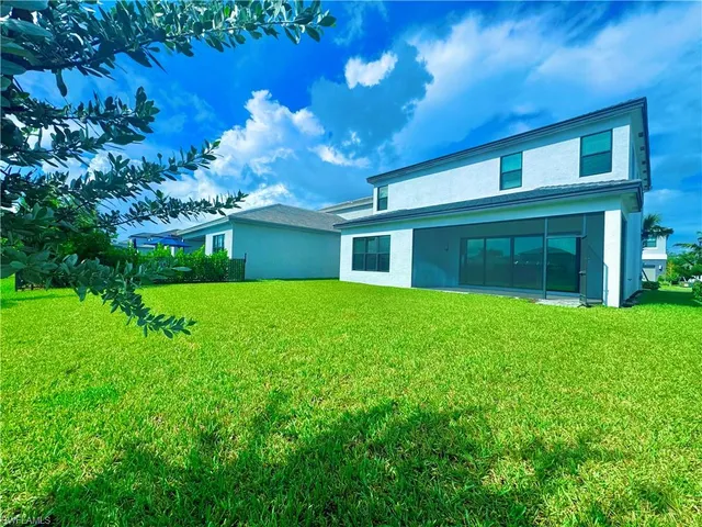 a view of balcony with yard