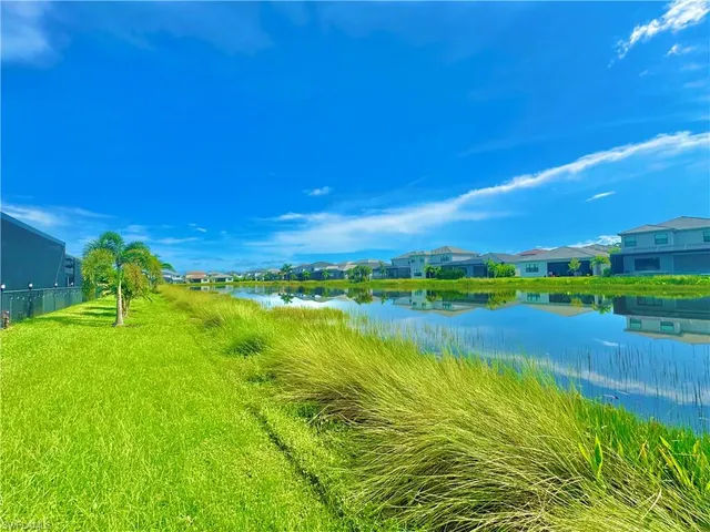 a kitchen with stainless steel appliances a sink a stove and cabinets
