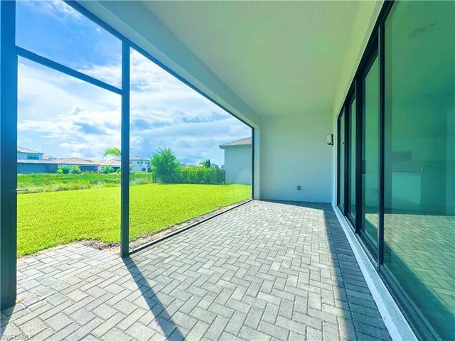 a view of a kitchen with dishwasher and white cabinets