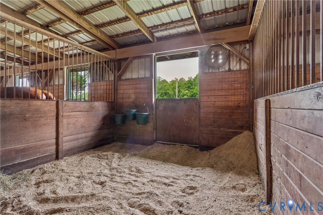 2016 Forge Road Toano, VA 23168 - Photo 19 of 99 Barn interior featuring wood stall walls, metal st