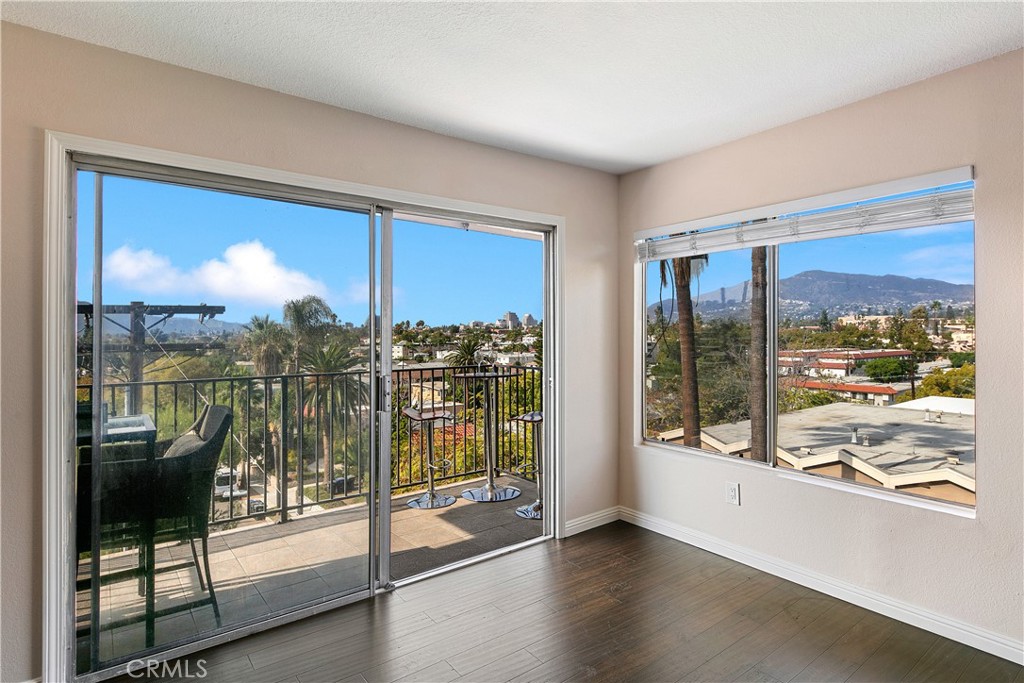 1517 East Garfield Avenue, Unit 53 Glendale, CA 91205 - Photo 13 of 53 a view of a room with gym equipment and floor to ceiling window