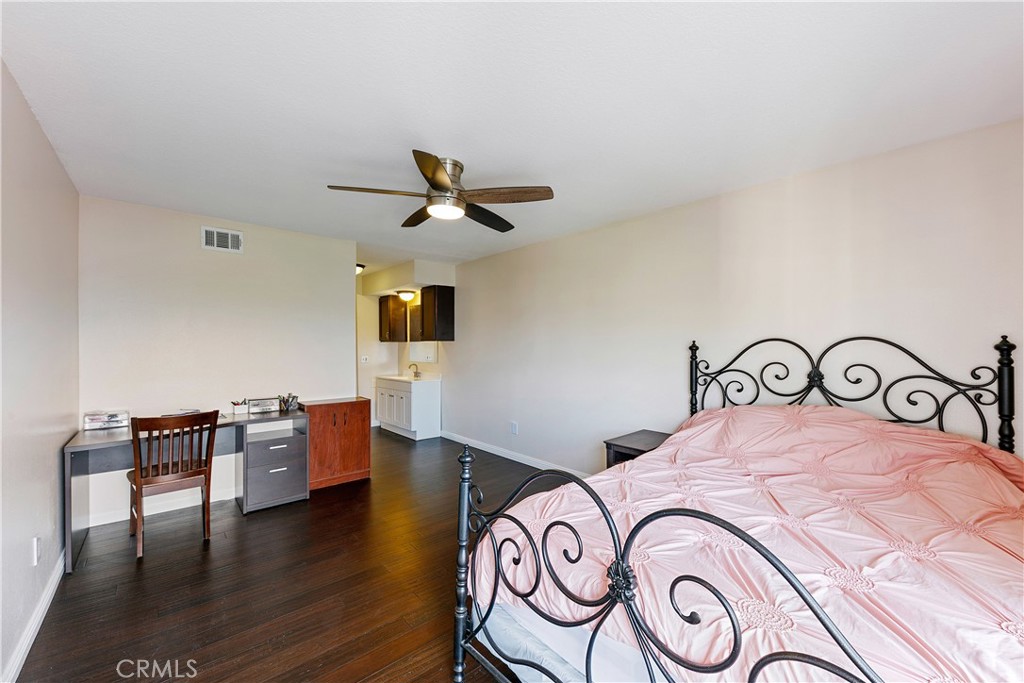 1517 East Garfield Avenue, Unit 53 Glendale, CA 91205 - Photo 20 of 53 a bedroom with a bed and wooden floor