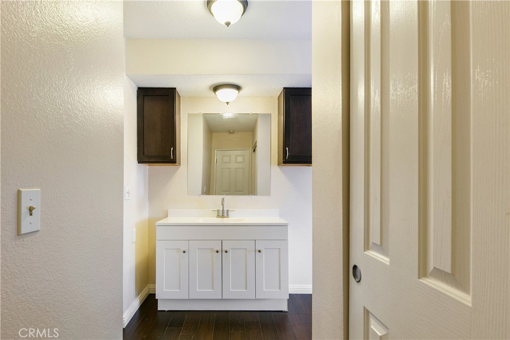 1517 East Garfield Avenue, Unit 53 Glendale, CA 91205 - Photo 21 of 53 a bathroom with a sink and a mirror