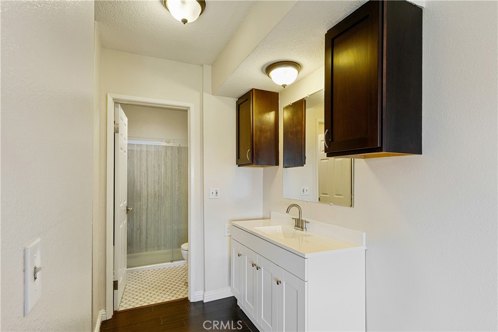1517 East Garfield Avenue, Unit 53 Glendale, CA 91205 - Photo 22 of 53 a bathroom with a sink and a mirror