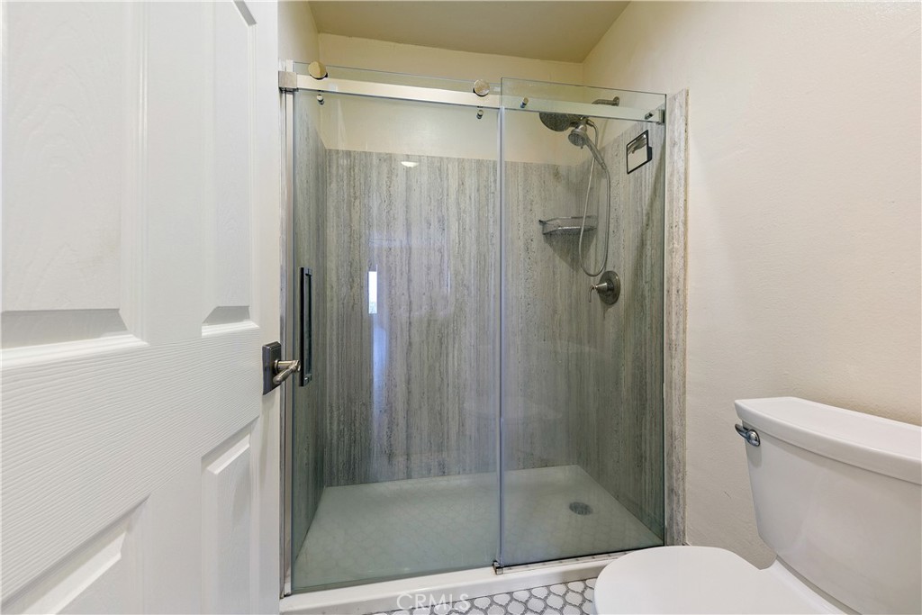 1517 East Garfield Avenue, Unit 53 Glendale, CA 91205 - Photo 23 of 53 a bathroom with a shower and toilet