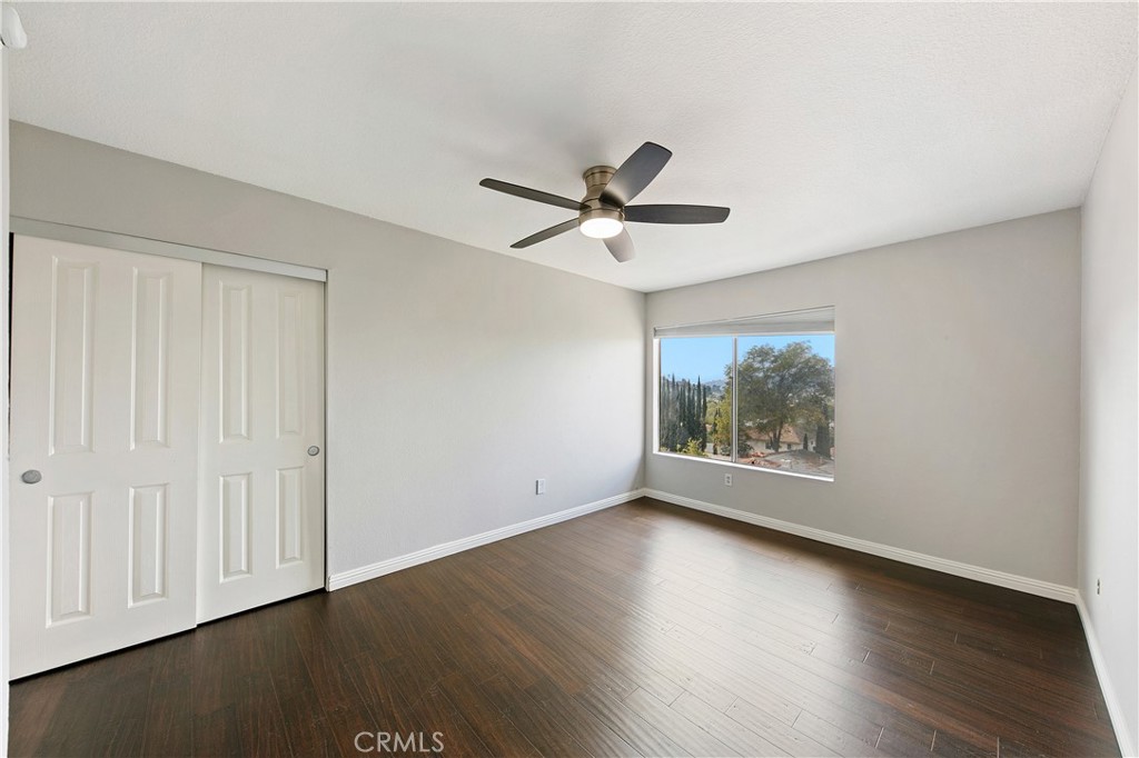 1517 East Garfield Avenue, Unit 53 Glendale, CA 91205 - Photo 24 of 53 an empty room with wooden floor and windows