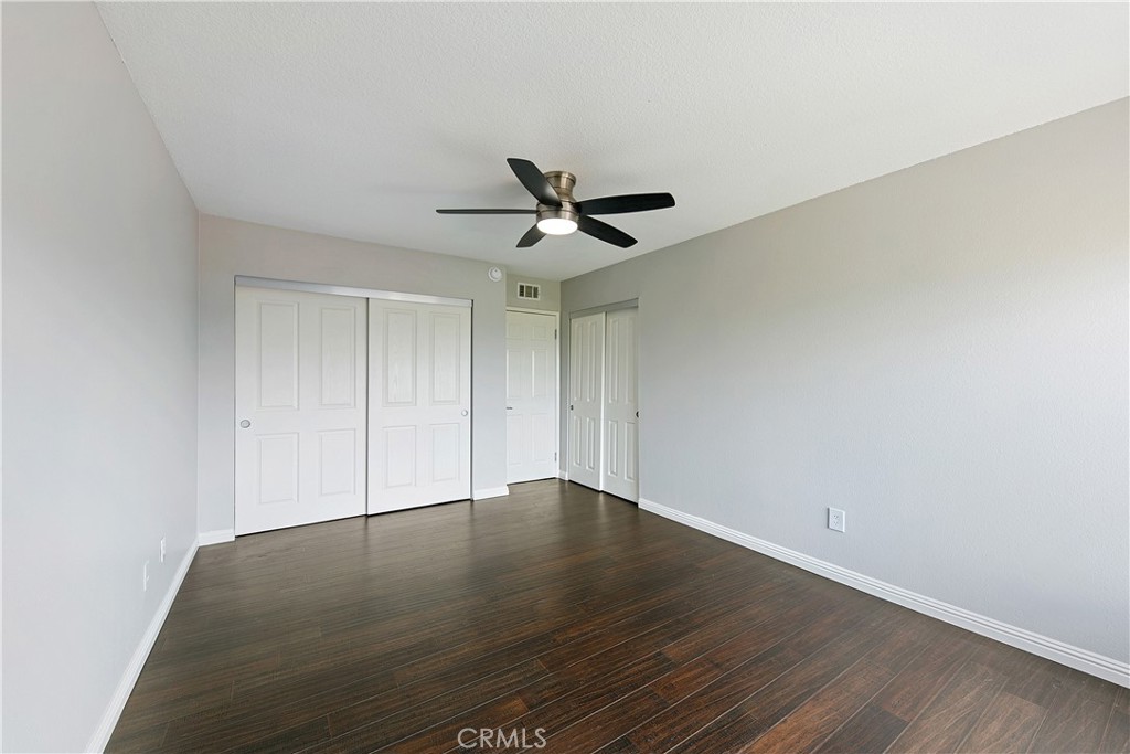 1517 East Garfield Avenue, Unit 53 Glendale, CA 91205 - Photo 25 of 53 an empty room with wooden floor and ceiling fan