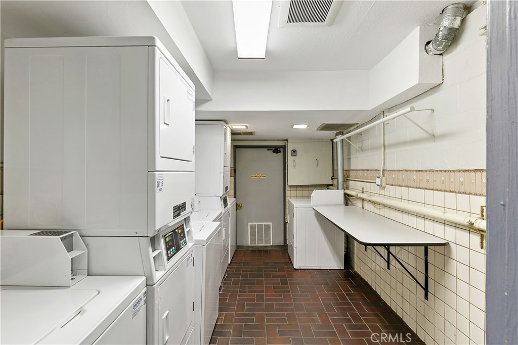 1517 East Garfield Avenue, Unit 53 Glendale, CA 91205 - Photo 30 of 53 a kitchen with a sink a refrigerator and cabinets