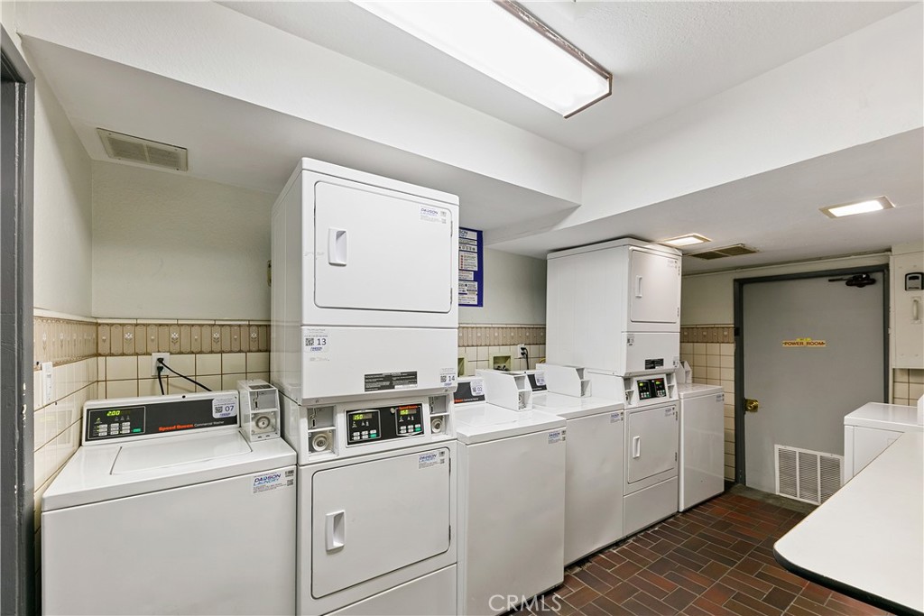 1517 East Garfield Avenue, Unit 53 Glendale, CA 91205 - Photo 31 of 53 a room with dryer and washer