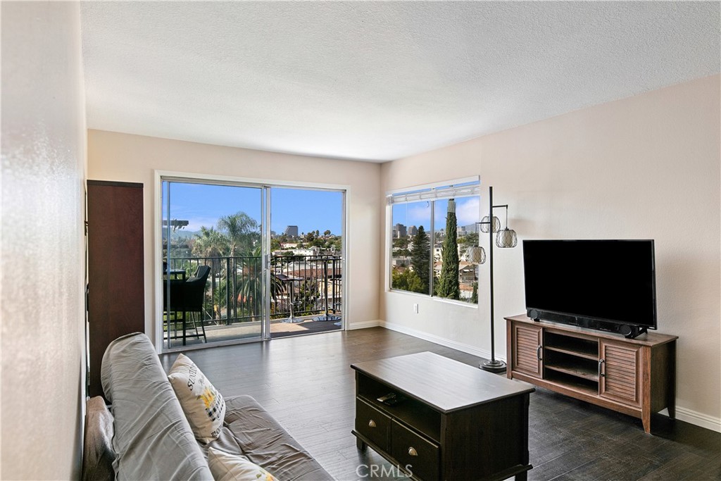 1517 East Garfield Avenue, Unit 53 Glendale, CA 91205 - Photo 10 of 53 a living room with furniture and a flat screen tv
