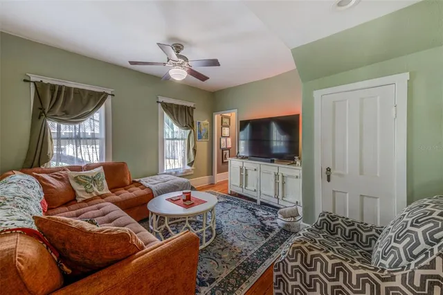 a living room with furniture and a rug
