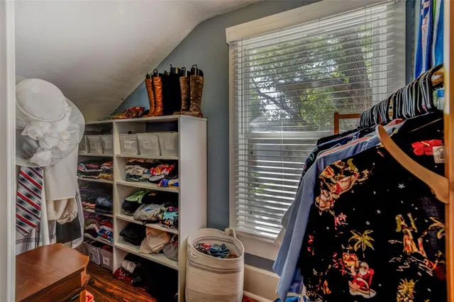 a bed room with a bed and a tv