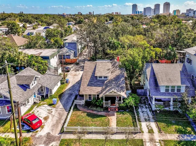an aerial view of houses with yard