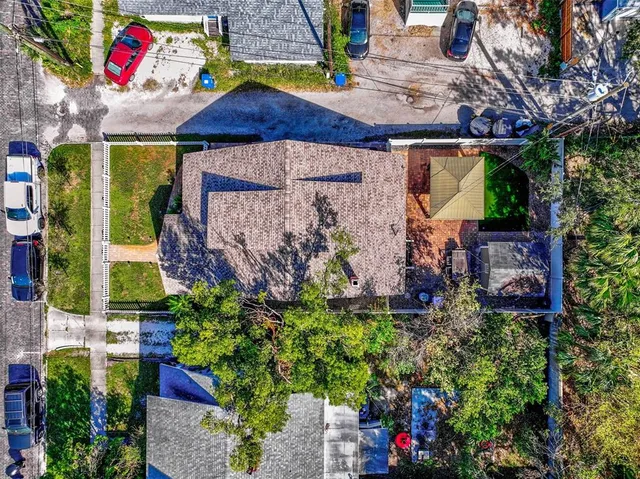 an aerial view of residential house with outdoor space and swimming pool