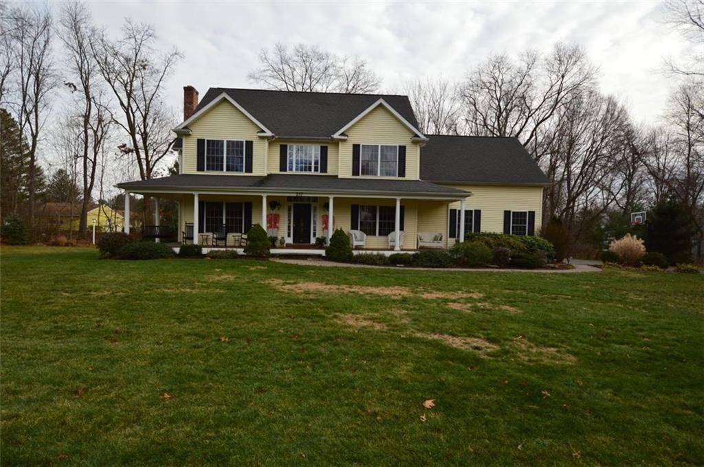 237 Harrison Road Cheshire, CT 06410 - Photo 1 of 1 a front view of a house with a garden and trees