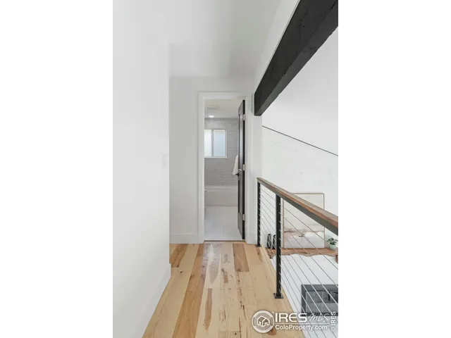 a view of a hallway with a white walls