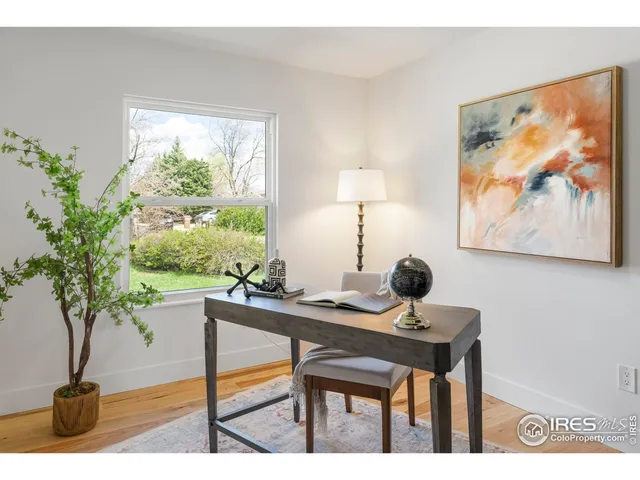 a view of a workspace filed with furniture and a potted plant
