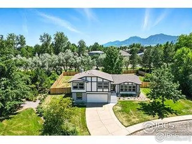 a house with trees in the background