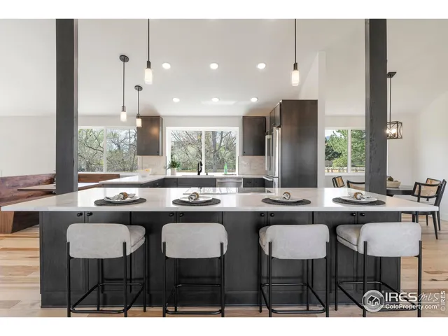 a kitchen with a table and chairs