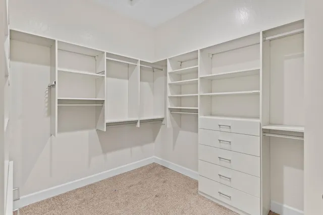 a view of an empty walk in closet