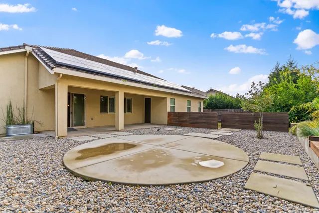 a house view with a backyard space