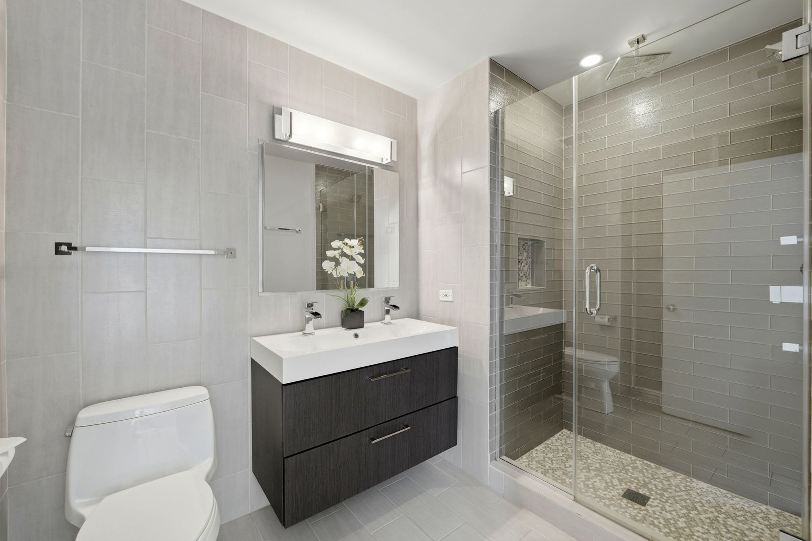 910 West Madison Street, Unit 808 Chicago, IL 60607 - Photo 17 of 37 a bathroom with a sink a toilet and shower