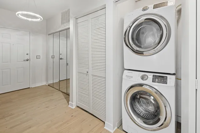 a view of a hallway with washer and dryer