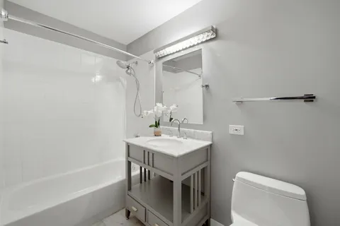 a bathroom with a sink a toilet and a bathtub