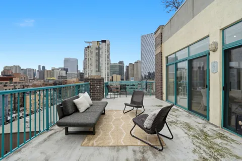 a view of a terrace with furniture