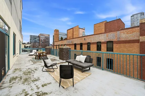 a view of roof deck with couch