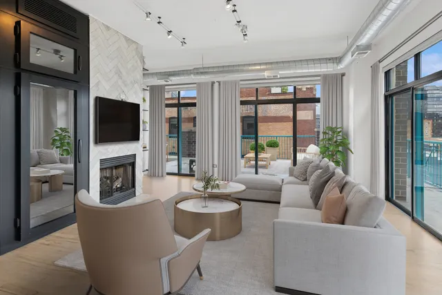 a living room with fireplace furniture and a flat screen tv