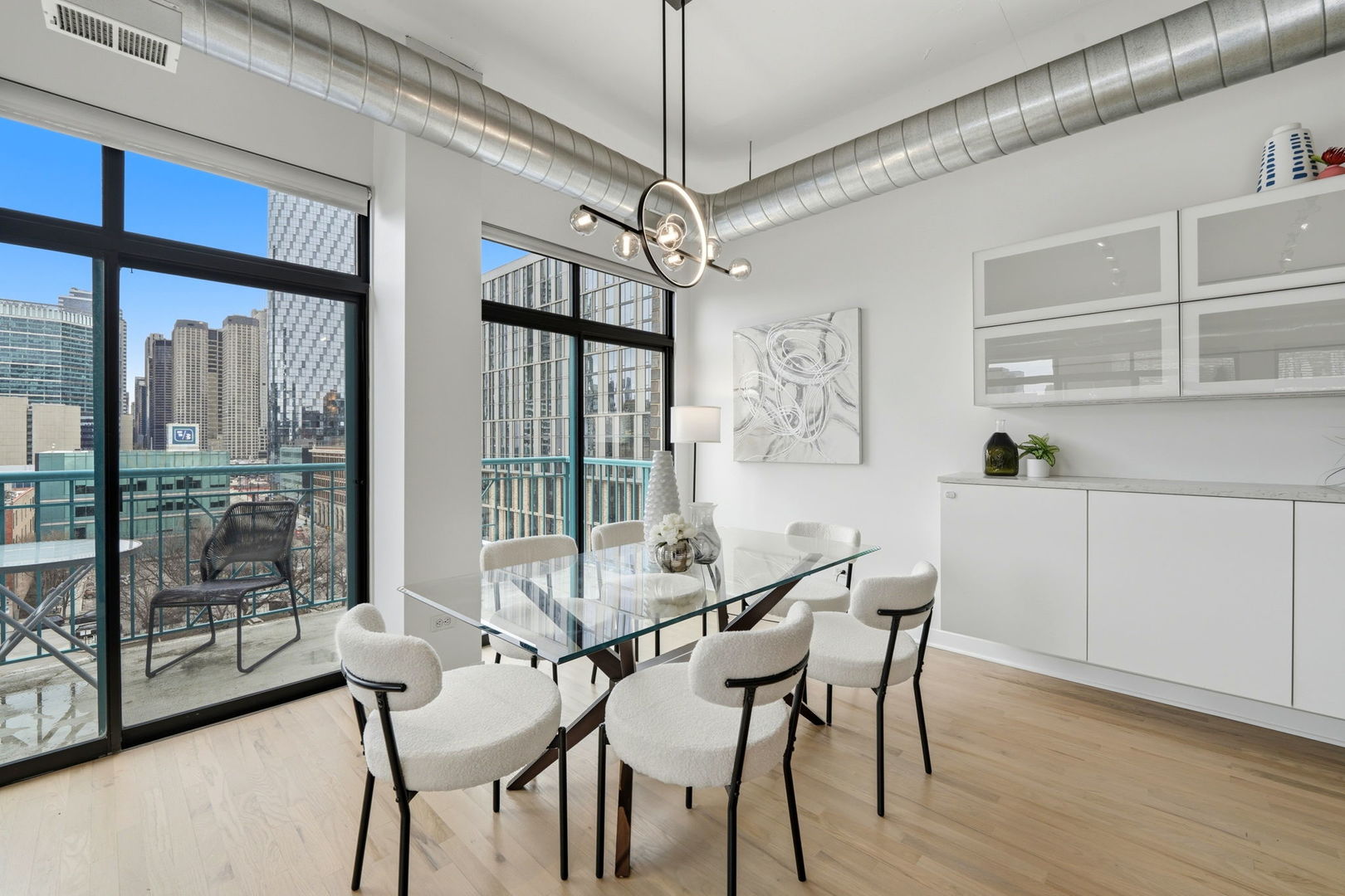 910 West Madison Street, Unit 808 Chicago, IL 60607 - Photo 10 of 37 a view of a dining room with furniture window and wooden floor