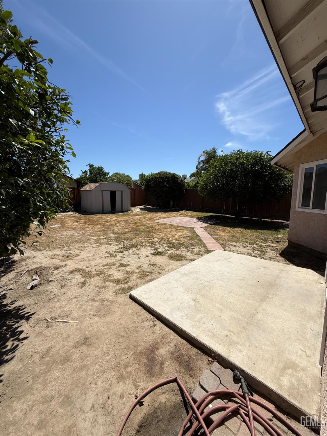 Undisclosed Address Bakersfield, CA 93307 - Photo 11 of 11 a view of a backyard of the house