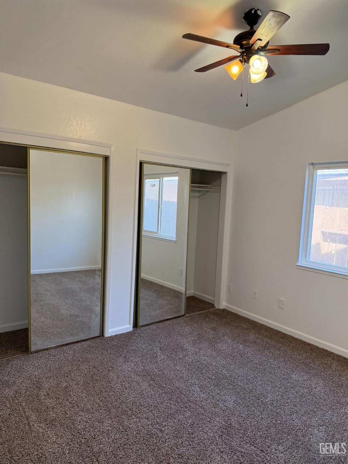 Undisclosed Address Bakersfield, CA 93307 - Photo 7 of 11 a view of an empty room with a fan