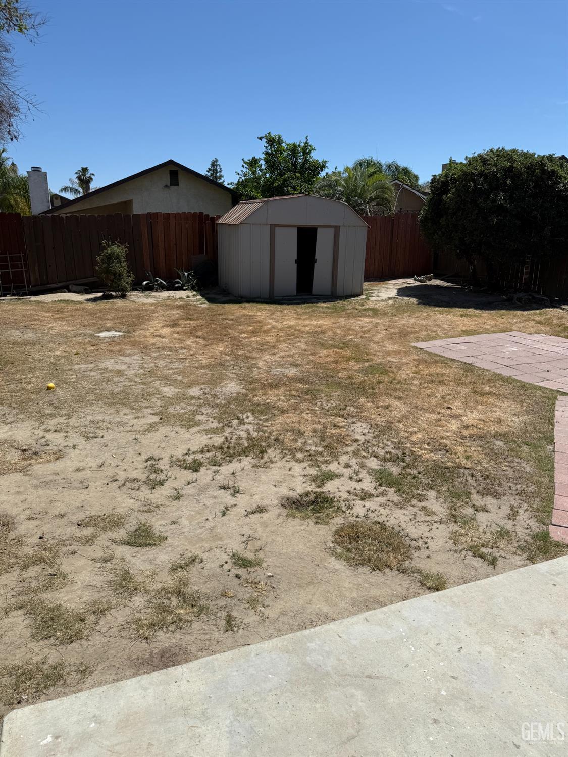 Undisclosed Address Bakersfield, CA 93307 - Photo 10 of 11 a view of a house with a yard