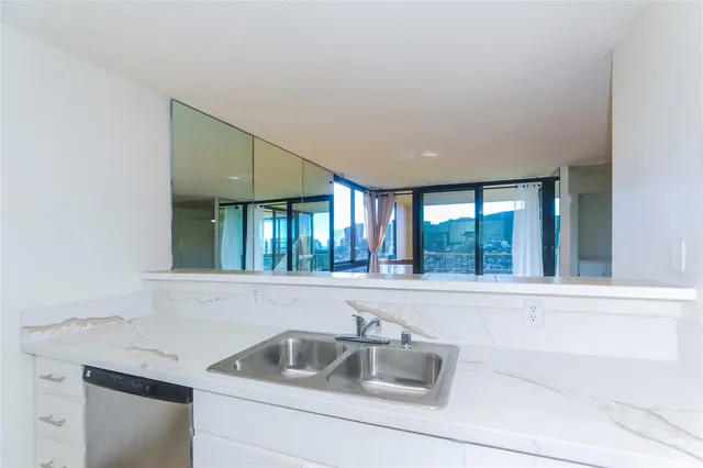 a kitchen with a sink and cabinets