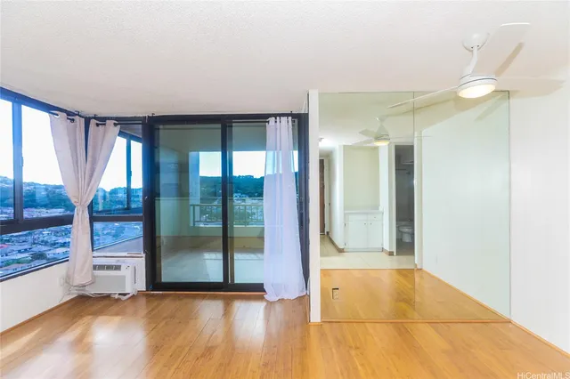 a view of an empty room with glass door
