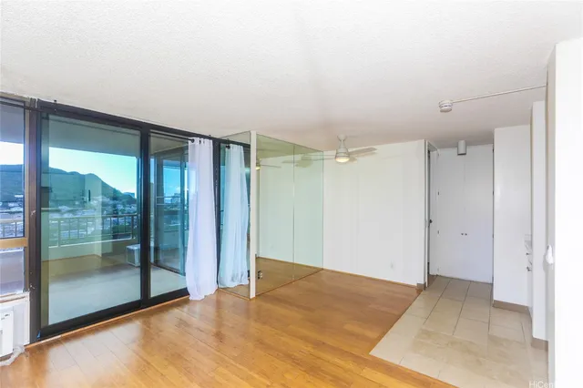 a view of an empty room with glass door
