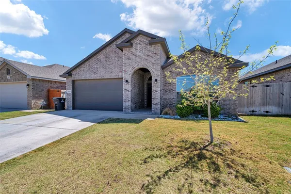 a kitchen with stainless steel appliances granite countertop a refrigerator stove and sink
