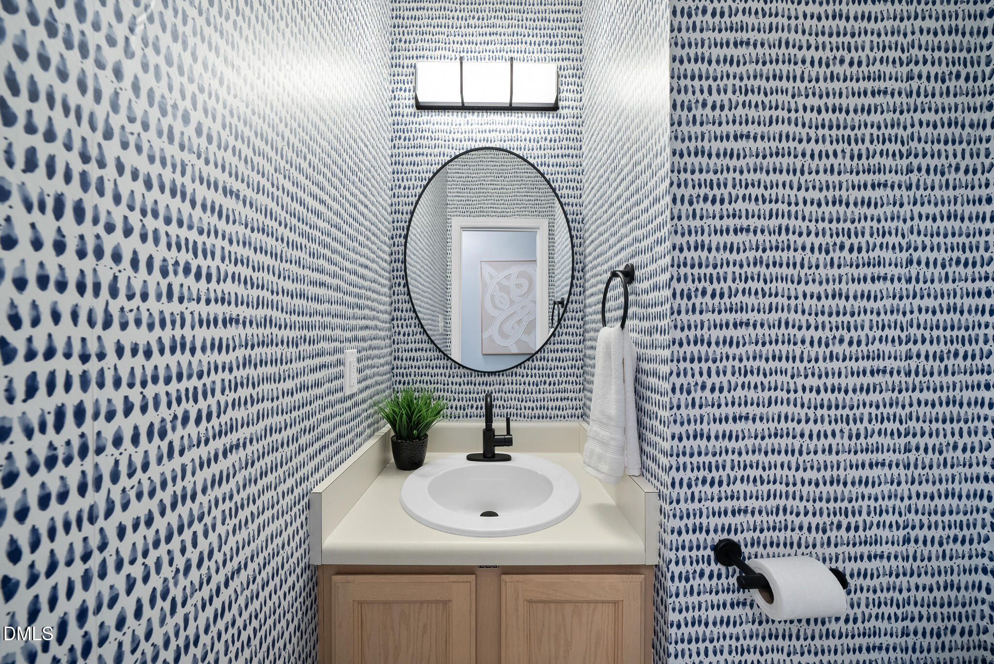 4126 Beaufain Street Raleigh, NC 27604 - Photo 9 of 36 a bathroom with a sink a mirror and bathtub