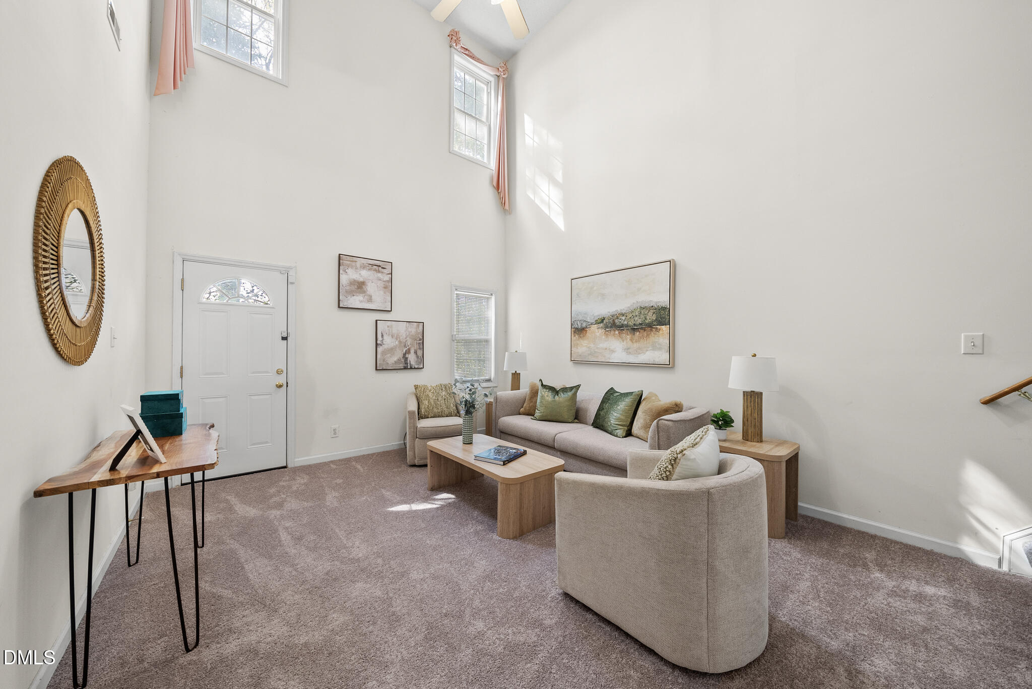 4126 Beaufain Street Raleigh, NC 27604 - Photo 14 of 36 a living room with furniture a couch and a potted plant