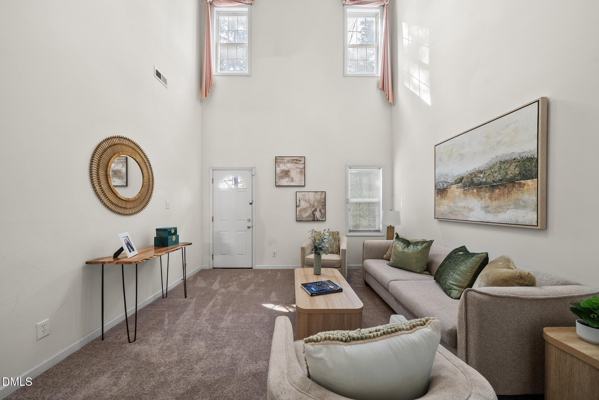 4126 Beaufain Street Raleigh, NC 27604 - Photo 15 of 36 a living room with furniture and a clock